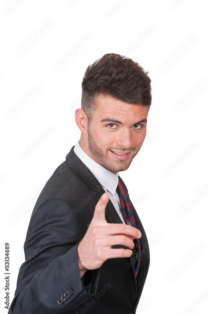 Smart dynamic young businessman pointing - on white