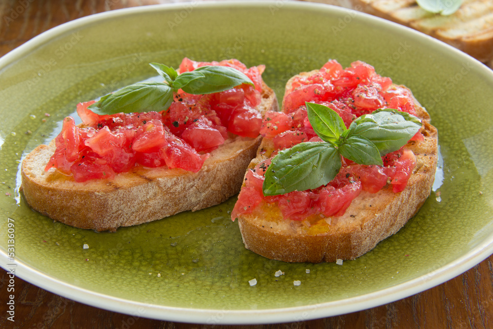 Bruschetta with tomato, basil and olive oil. Bruschetta with tomato, basil and olive oil.
