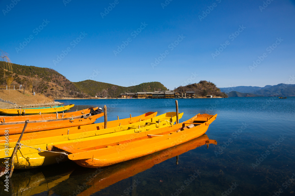 wooden boats in the Lugu lake