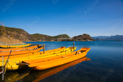 Obraz na płótnie wooden boats in the Lugu lake w salonie