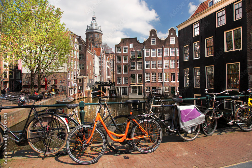 Fototapeta premium Amsterdam city with bikes on the bridge, Holland