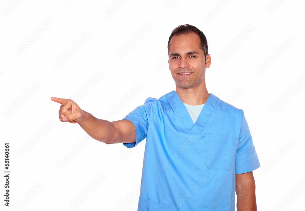 Smiling nurse in uniform pointing to his right Smiling nurse in uniform pointing to his right