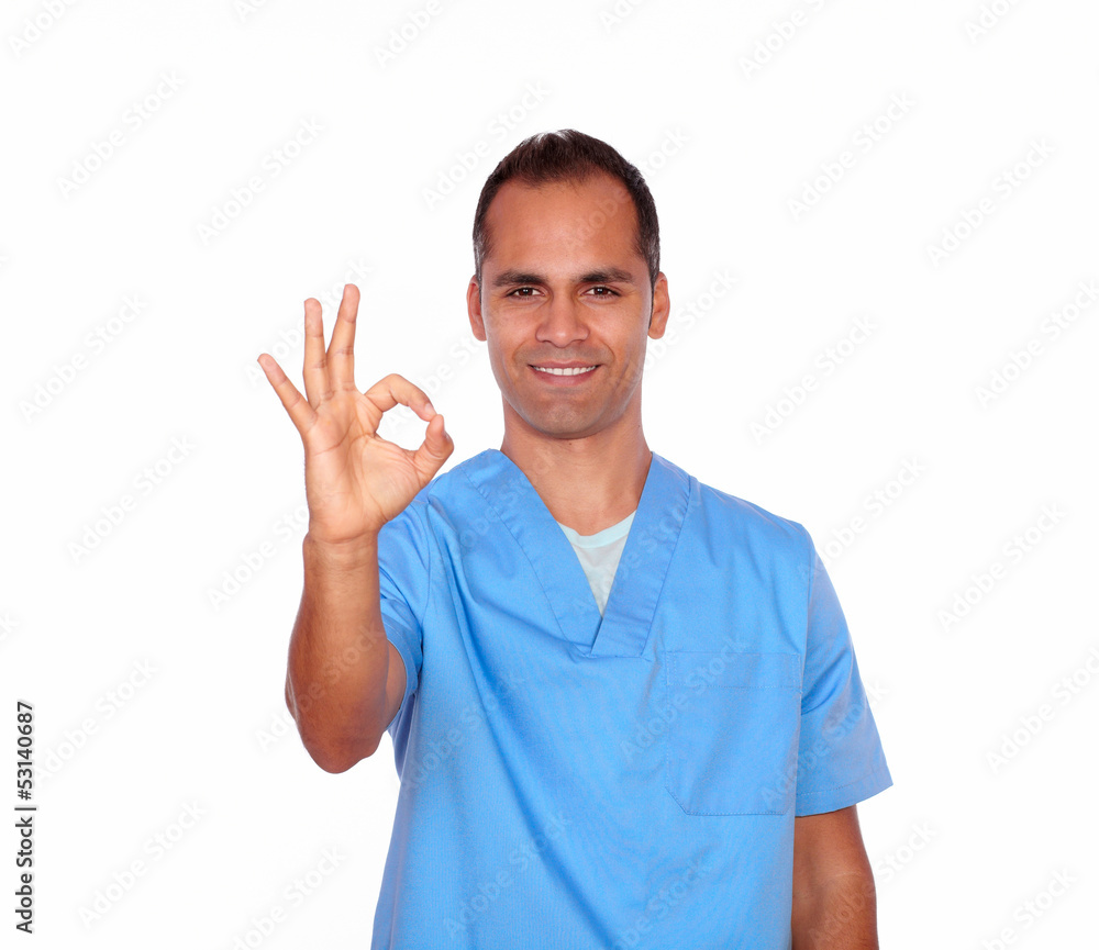 Handsome nurse showing positive sign with hand Handsome nurse showing positive sign with hand