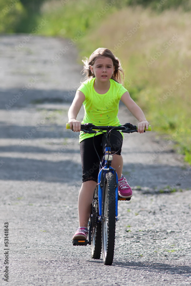 Naklejka premium Teens girl on bike