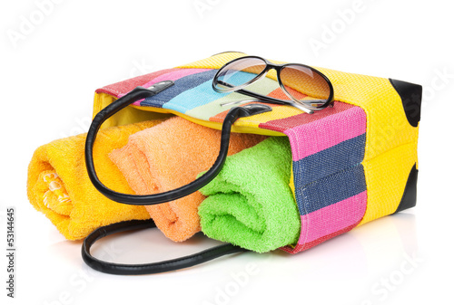 Beach bag with towels and sunglasses