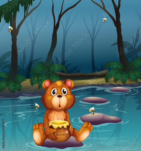 A bear sitting on a stone holding a pot of honey