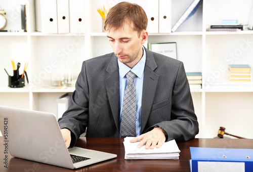 Young businessman in office...