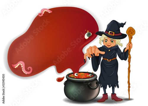 A witch holding a stick with a pot