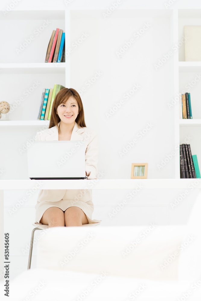 Beautiful young businesswoman working in office Beautiful young businesswoman working in office