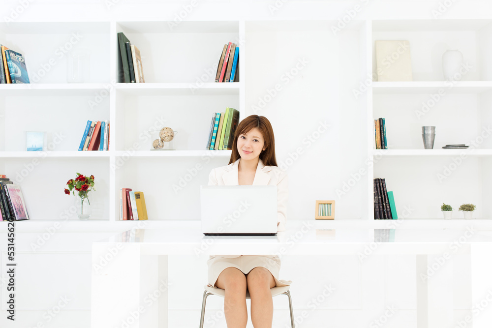 Beautiful young businesswoman working in office Beautiful young businesswoman working in office