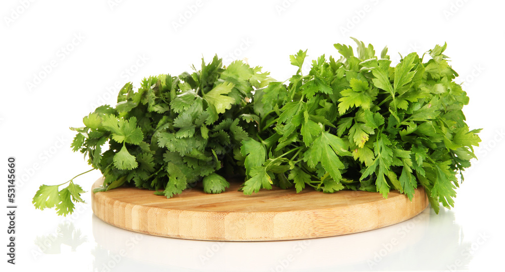 Useful herbs on wooden cutting board isolated on white Useful herbs on wooden cutting board isolated on white