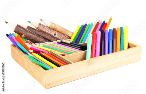 Different pencils in wooden crate, isolated on white photo