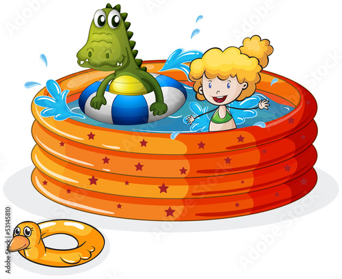 A girl and a crocodile swimming inside the inflatable pool
