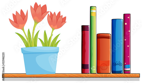 A wooden shelf with a pot of flower and books