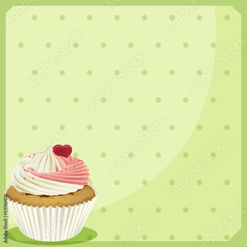 A cupcake in a green wallpaper