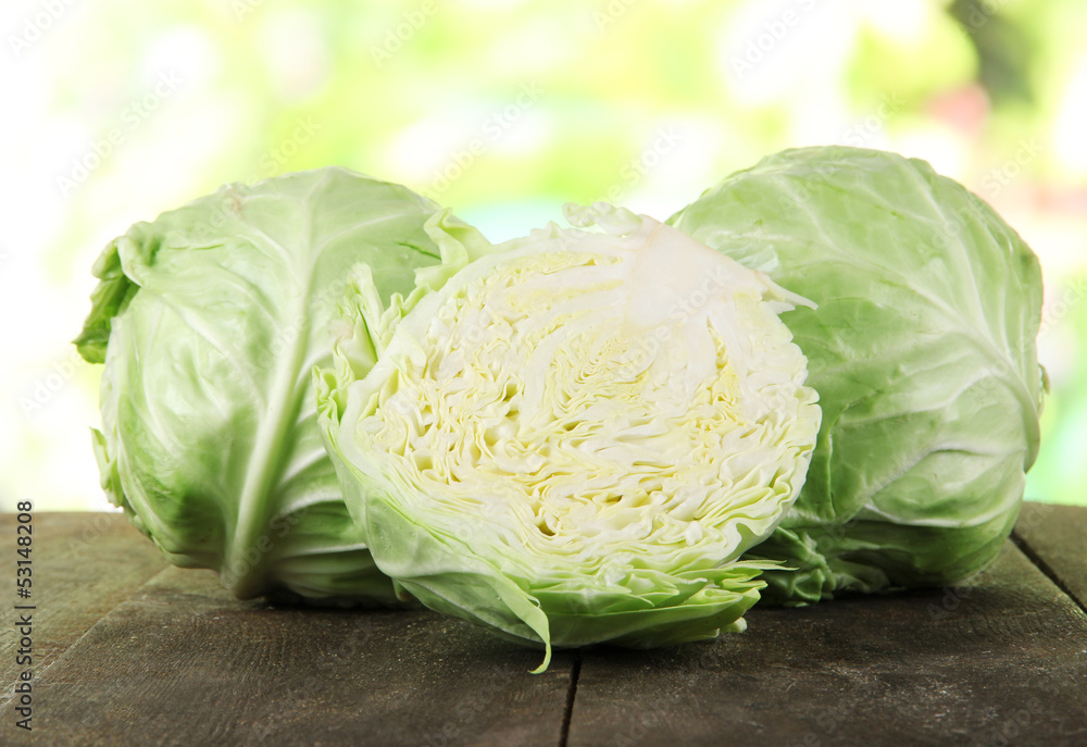 Cabbage on wooden table on nature background Cabbage on wooden table on nature background