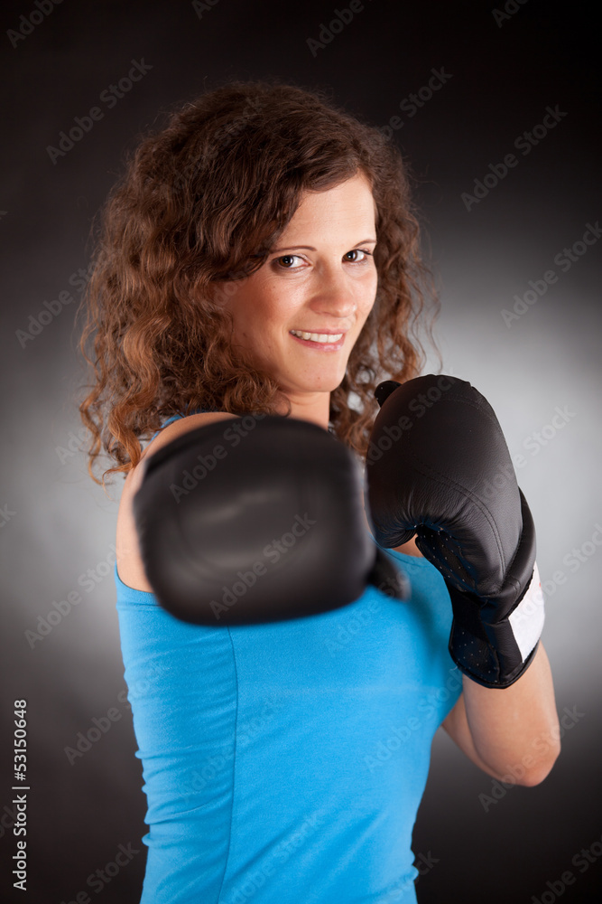 beautiful sporty woman with box gloves