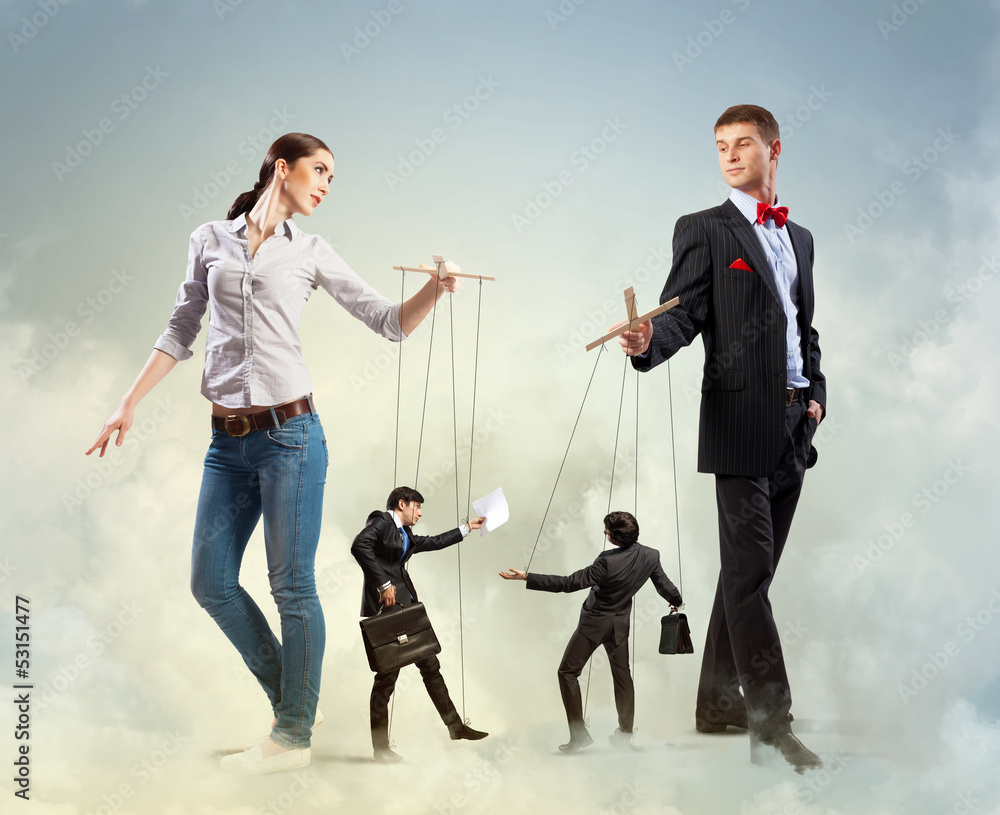Businesspeople with marionettes Businesspeople with marionettes