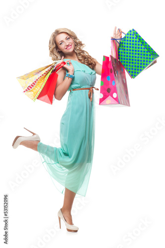 Blond girl holding shopping bags