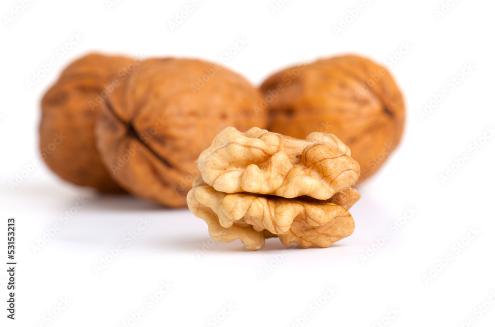walnut and a cracked walnut isolated on the white background walnut and a cracked walnut isolated on the white background