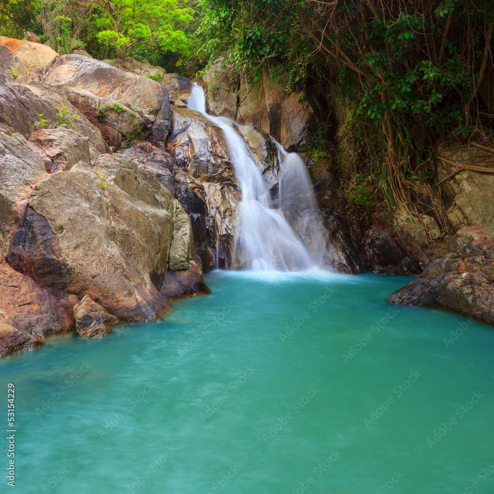 Fototapeta premium Waterfall with pool in tropical jungle, Na Muang, Koh Samui
