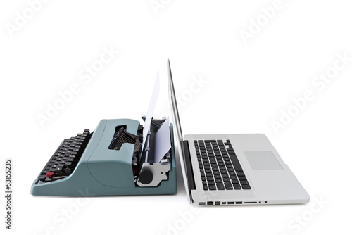 contemporary laptop vs old typewriter