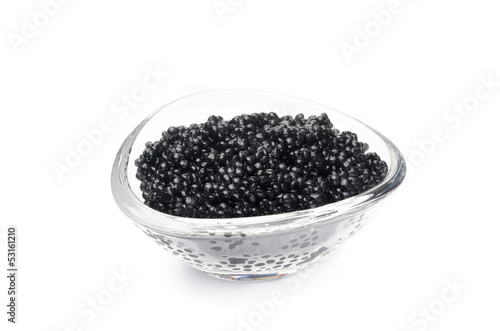 black caviar in a glass bowl isolated on a white background