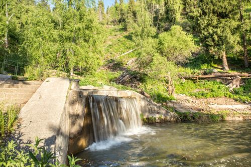 Nature of  green trees and cascade of river near Medeo
