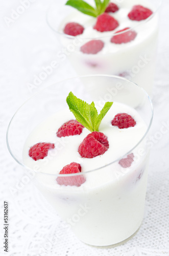 panna cotta with fresh raspberries close-up