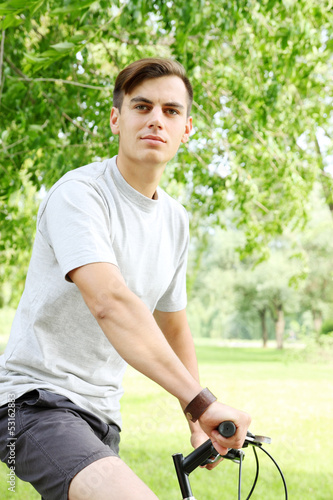 friendly young guy on bicycle © Mallivan