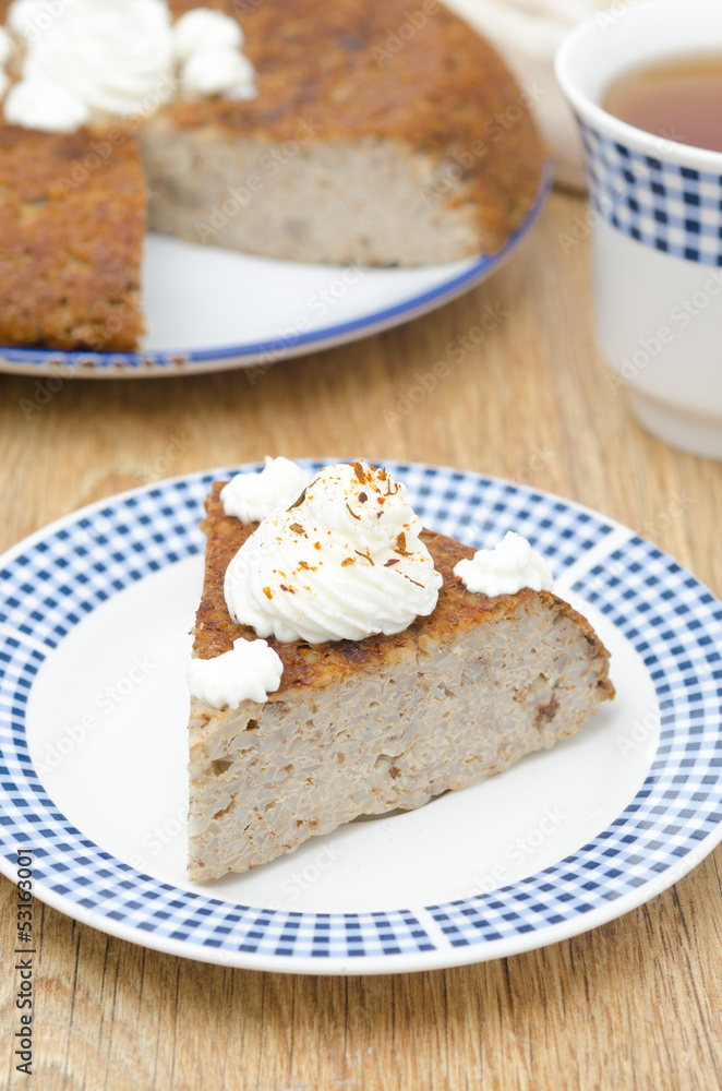 piece of buckwheat cake (krupenik) with curd cream