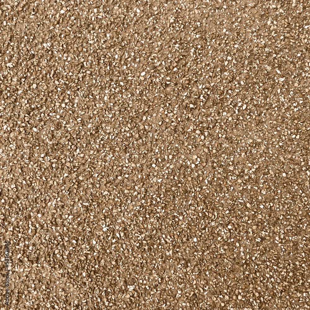 Multi grain brown and yellow pebbles background or texture Multi grain brown and yellow pebbles background or texture