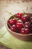 fresh cherries in a wooden bowl