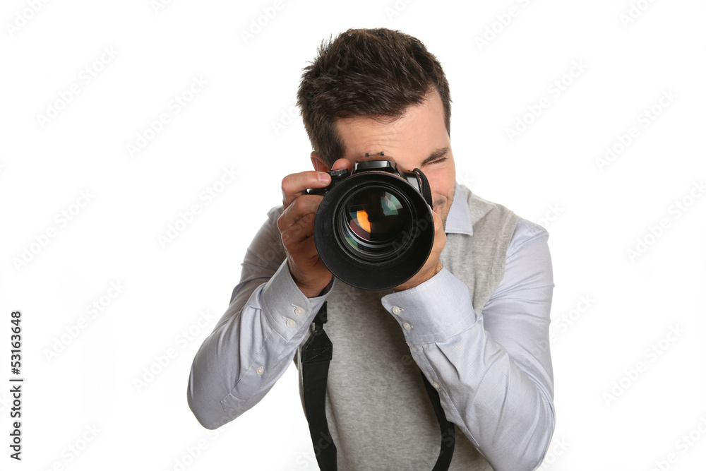 Portrait of photographer holding digital camera