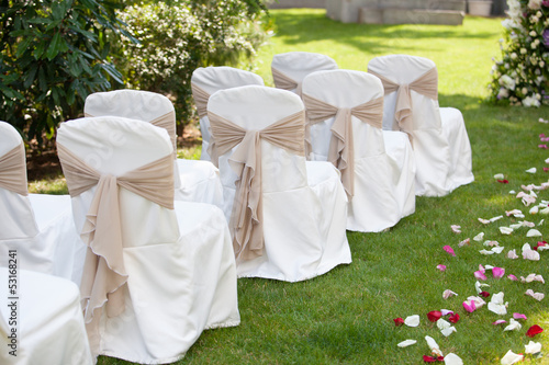 wedding chairs with the white covers