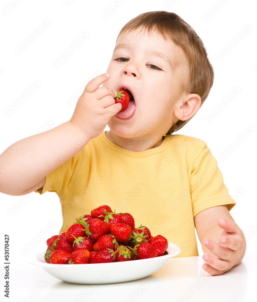 Happy little boy with strawberries Happy little boy with strawberries
