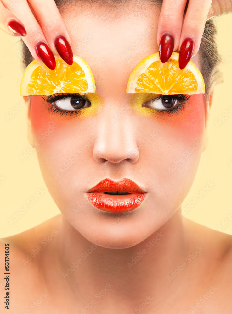Woman beauty concept with lemon slices over eyes Woman beauty concept with lemon slices over eyes