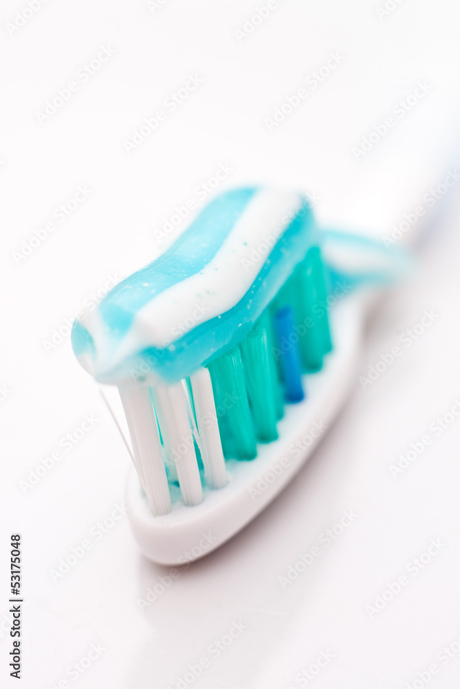 Tooth paste on brush, close up Tooth paste on brush, close up