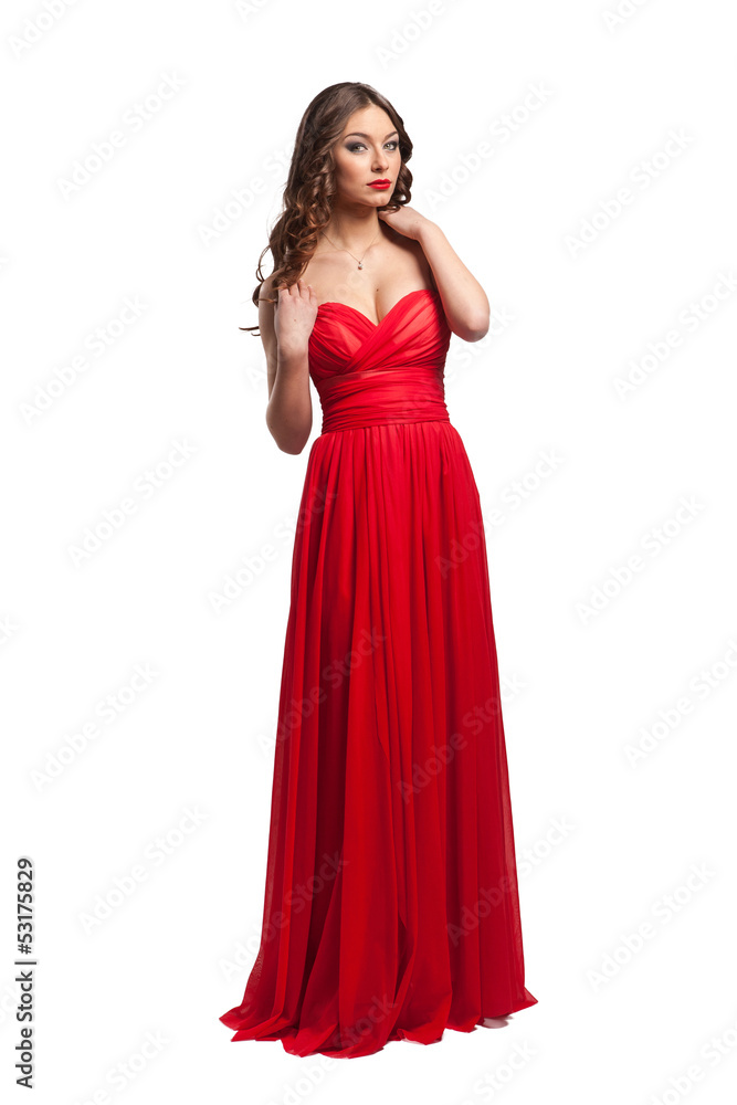 Beautiful female fashion model posing in red dress