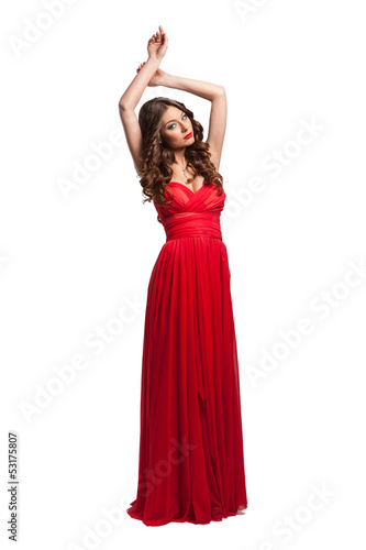 Beautiful female fashion model posing in red dress