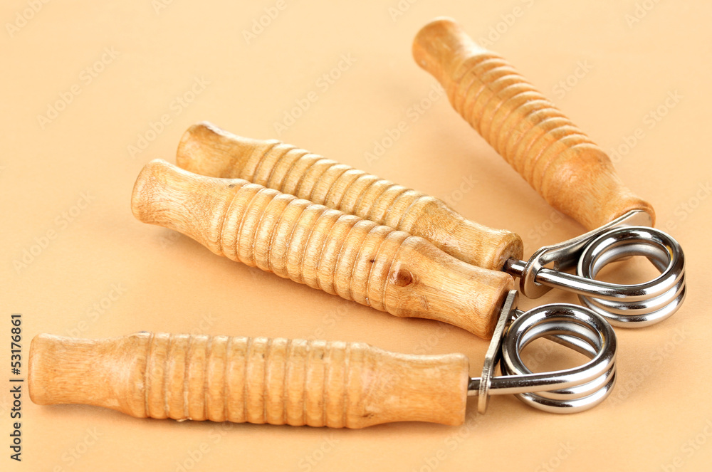 Modern hand trainer on beige background Modern hand trainer on beige background