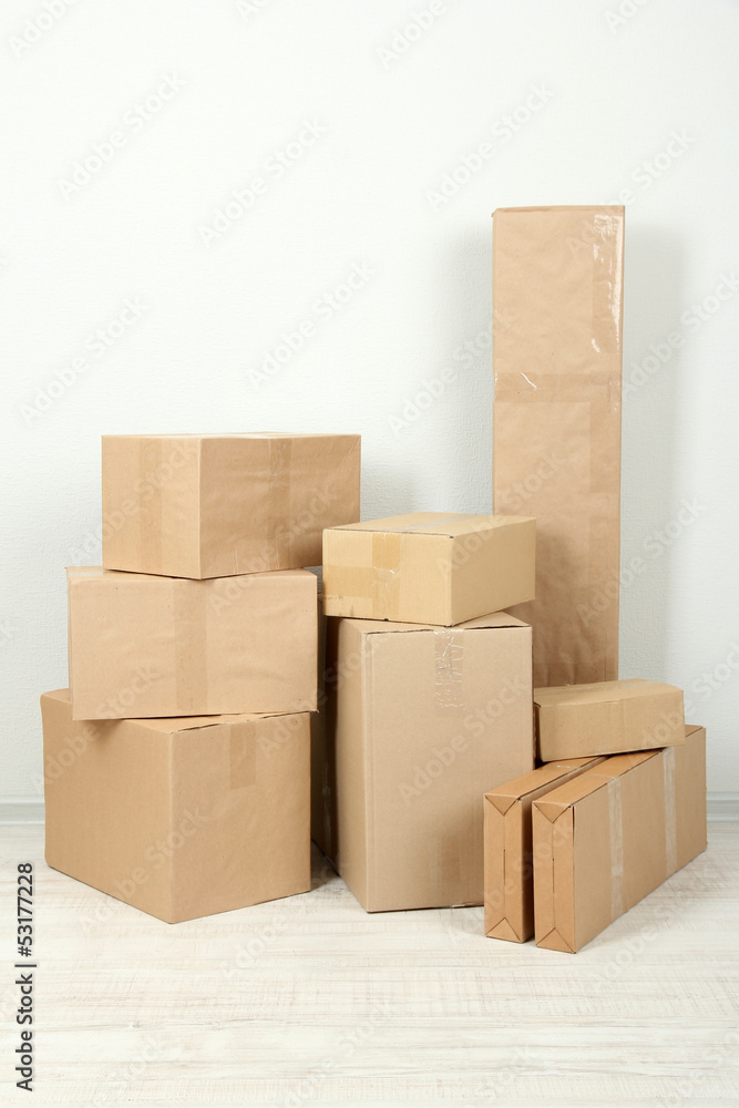 Different cardboard boxes in room