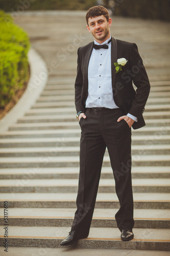 groom walking on staircase