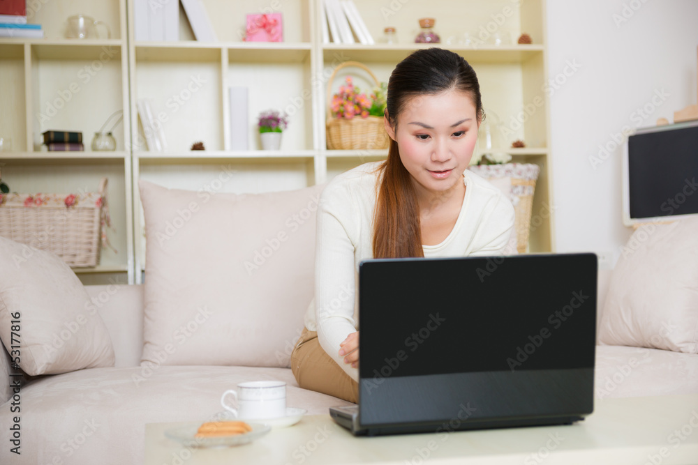 young asian woman using a laptop young asian woman using a laptop