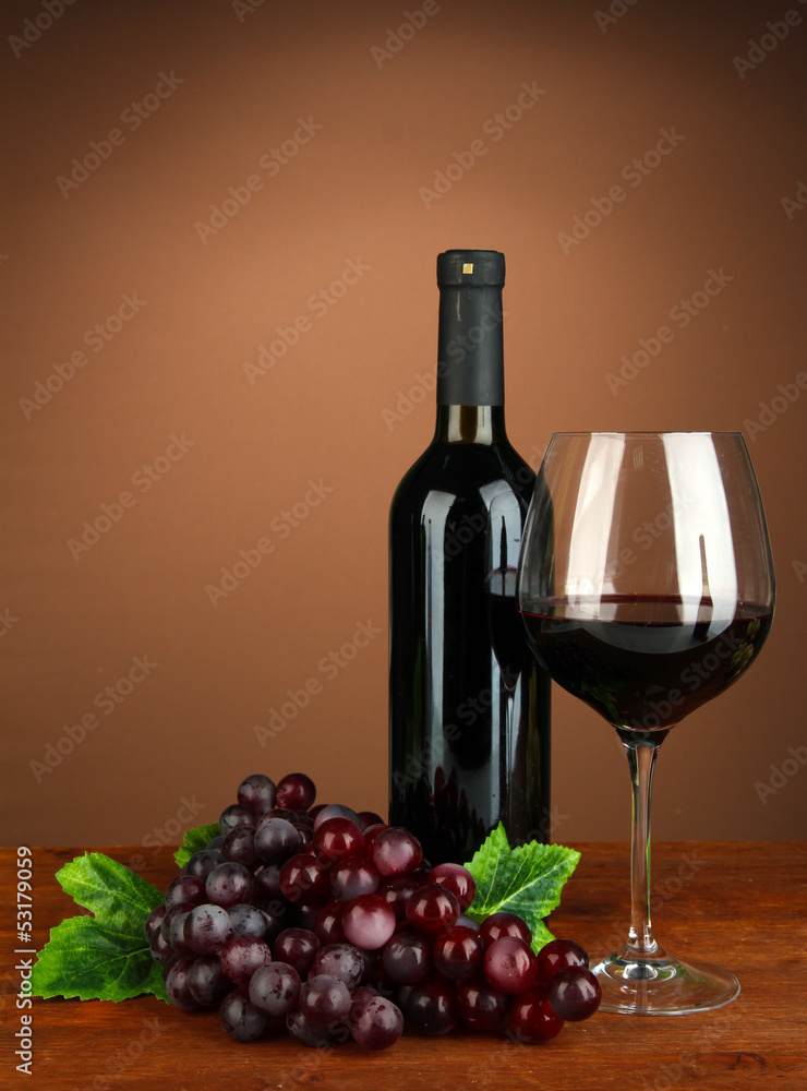 Composition of wine bottle, glass of red wine, grape