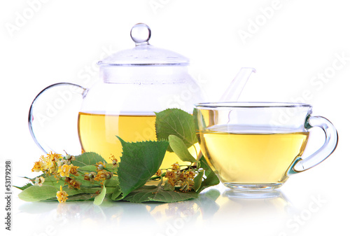 Kettle and cup of tea with linden isolated on white