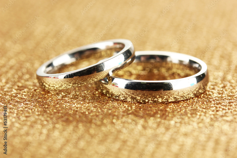 Wedding rings on bright background