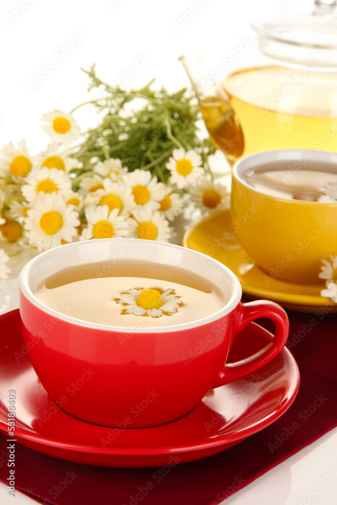 Cups of herbal tea with camomiles close up Cups of herbal tea with camomiles close up