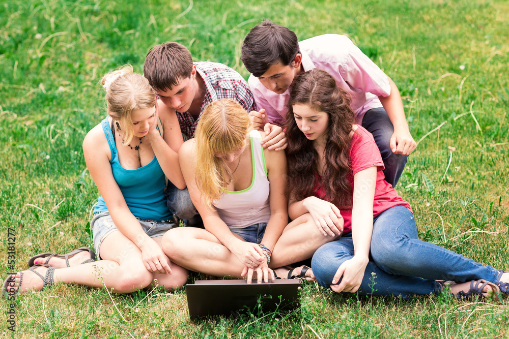 Group of happy smiling Teenage Students Outside College Group of happy smiling Teenage Students Outside College