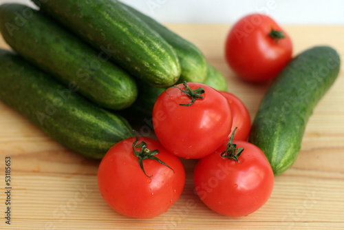 Cucumbers and tomatoes on a table